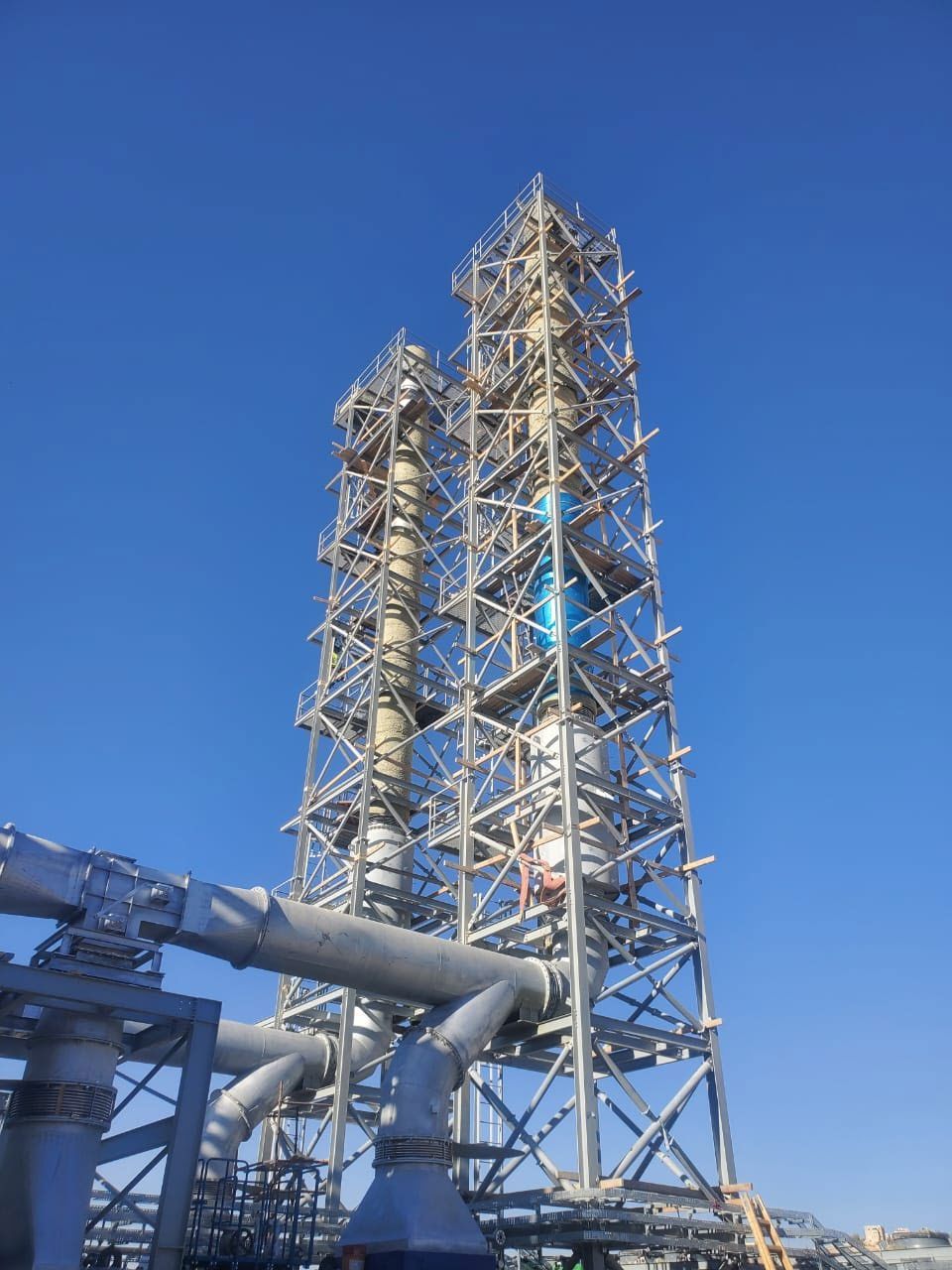 Gas engine power plant exhaust stacks under erection