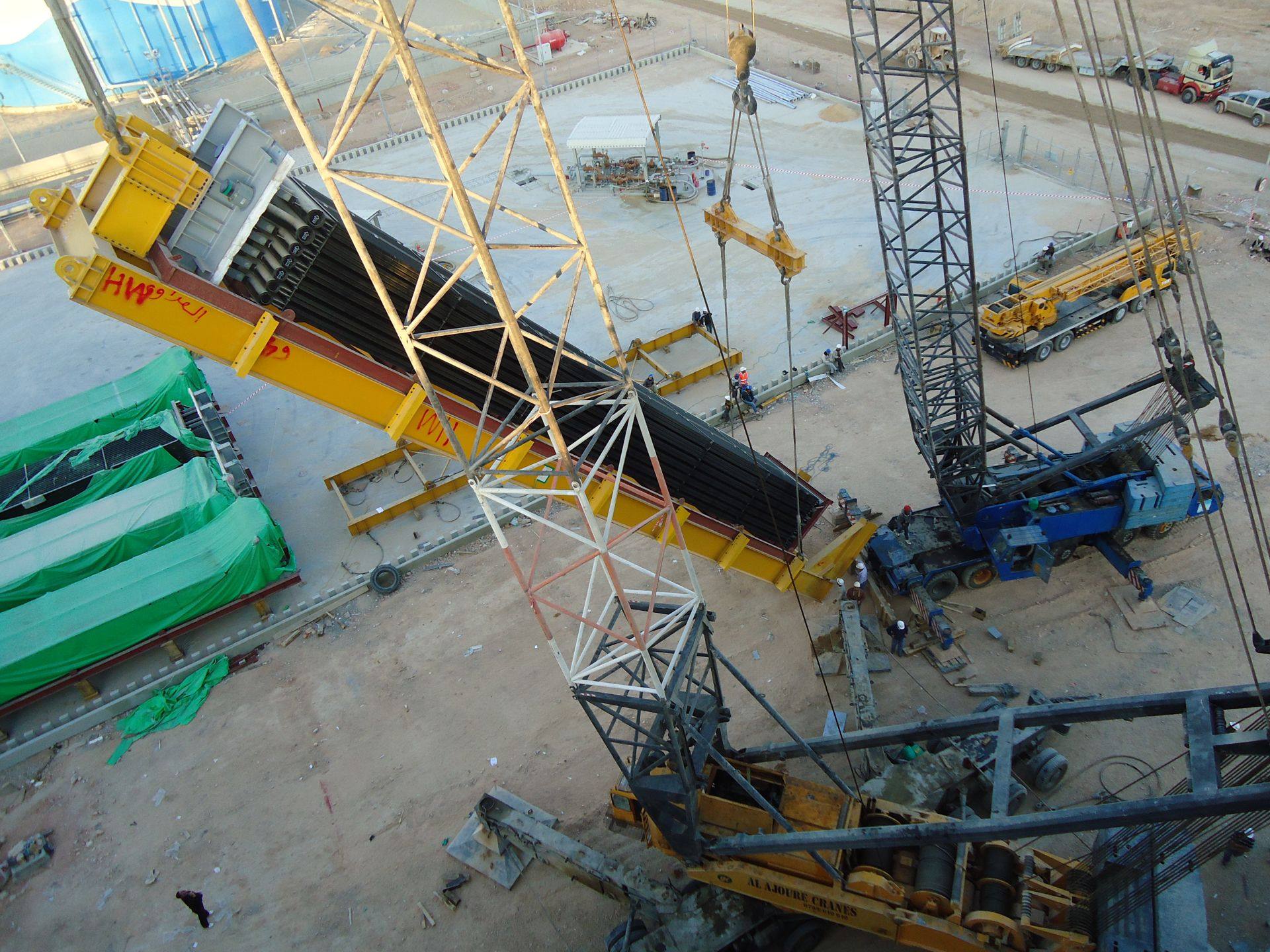 Crawler crane erecting conveyor and stacker structure at a phosphate plant